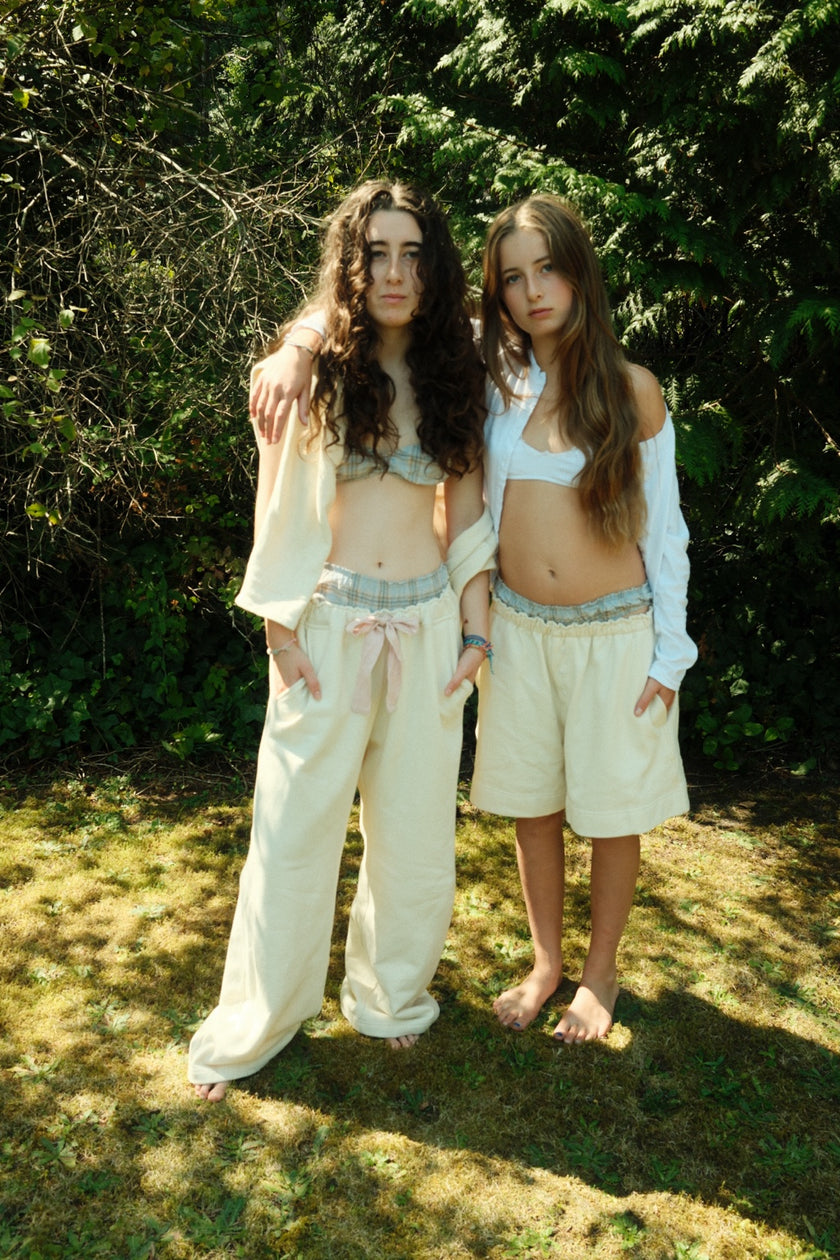 Two models outdoors wearing Smith Bowen cream Field Fleece Pant and coordinating Field Fleece Boxer
